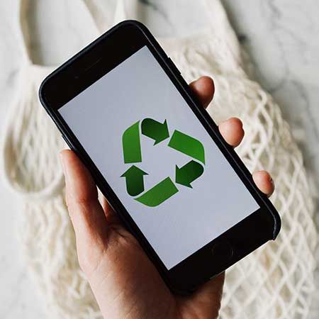 A smartphone showing a recycling symbol