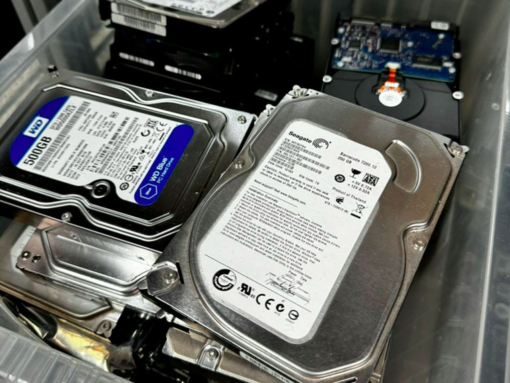Hard drives staged for serialised, certificate-backed destruction for Hertfordshire clients