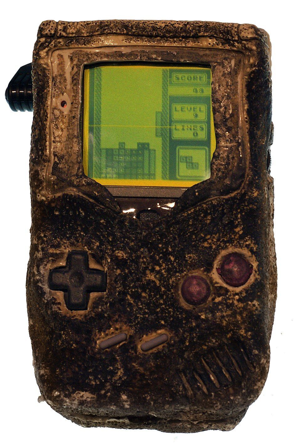 A badly damaged handheld console