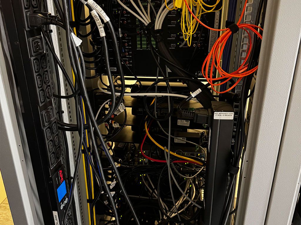 Decommissioned IT hardware packed for secure removal from a Surrey office