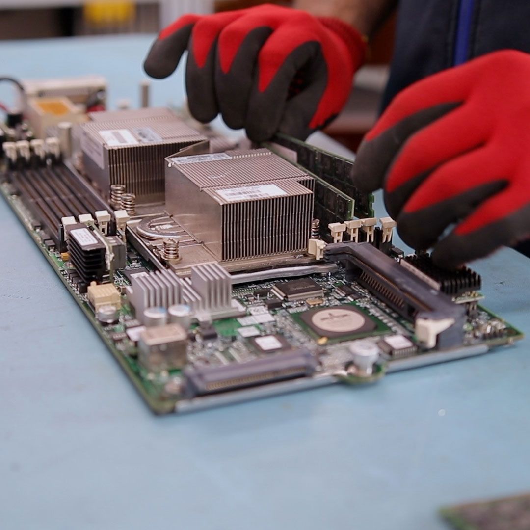 A technician working on a circuit board